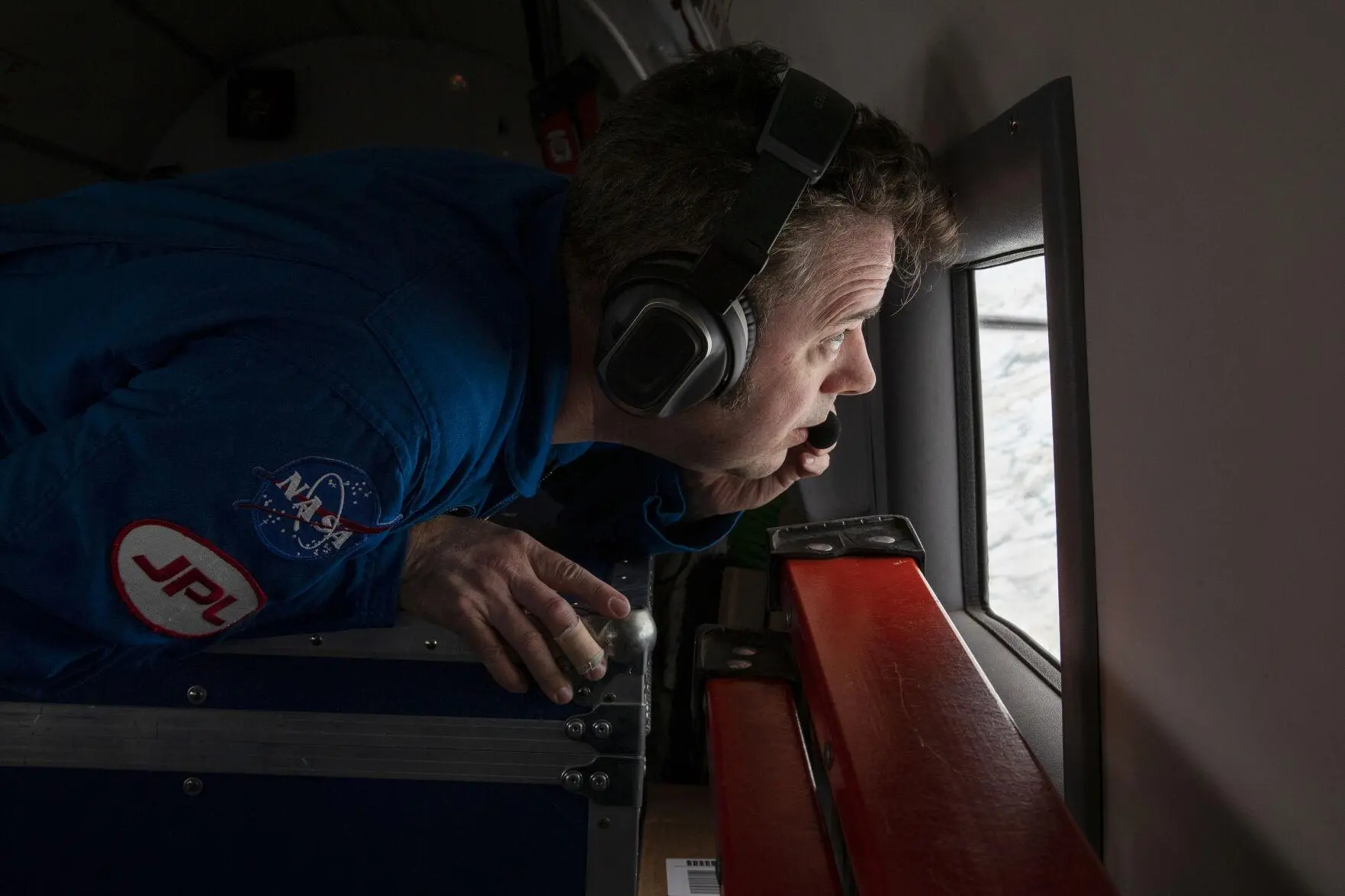 A NASA sciencetist watches over the glacier 