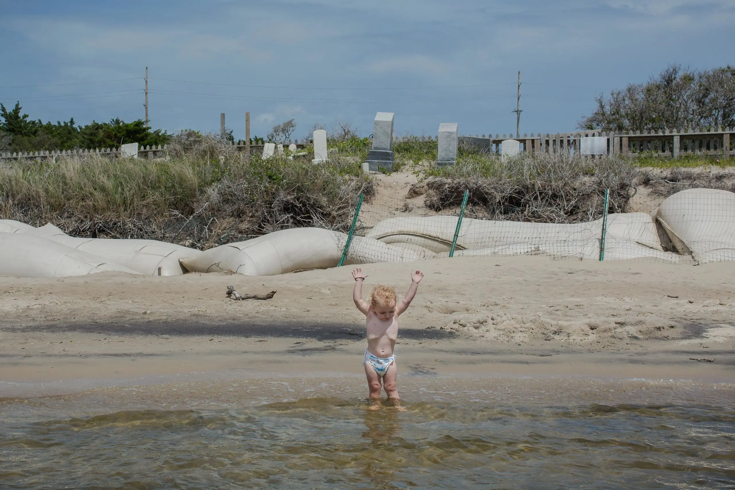 Young girl plays in the water