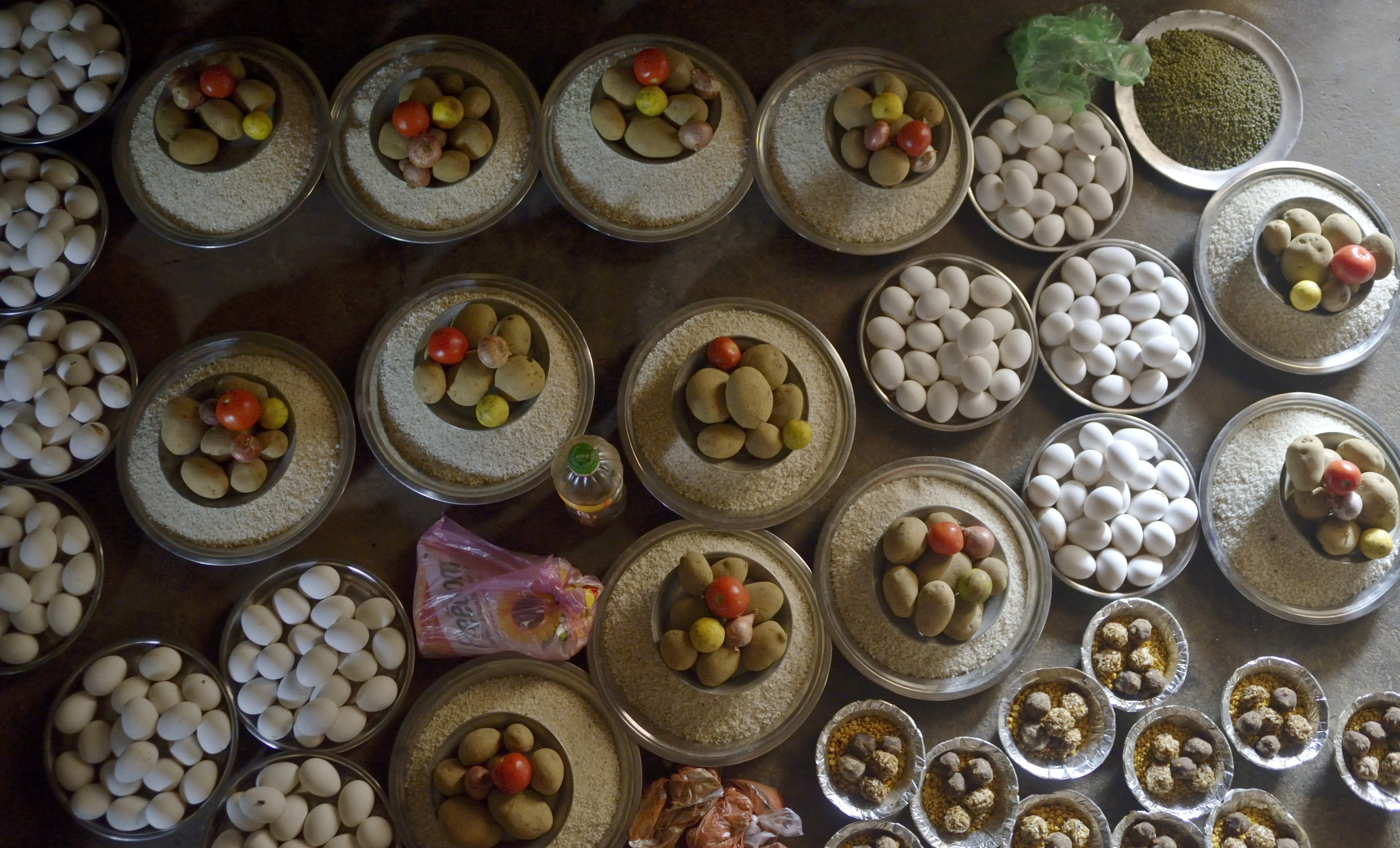 Food items in small bowls that will transported to a center where young and pregnant women are