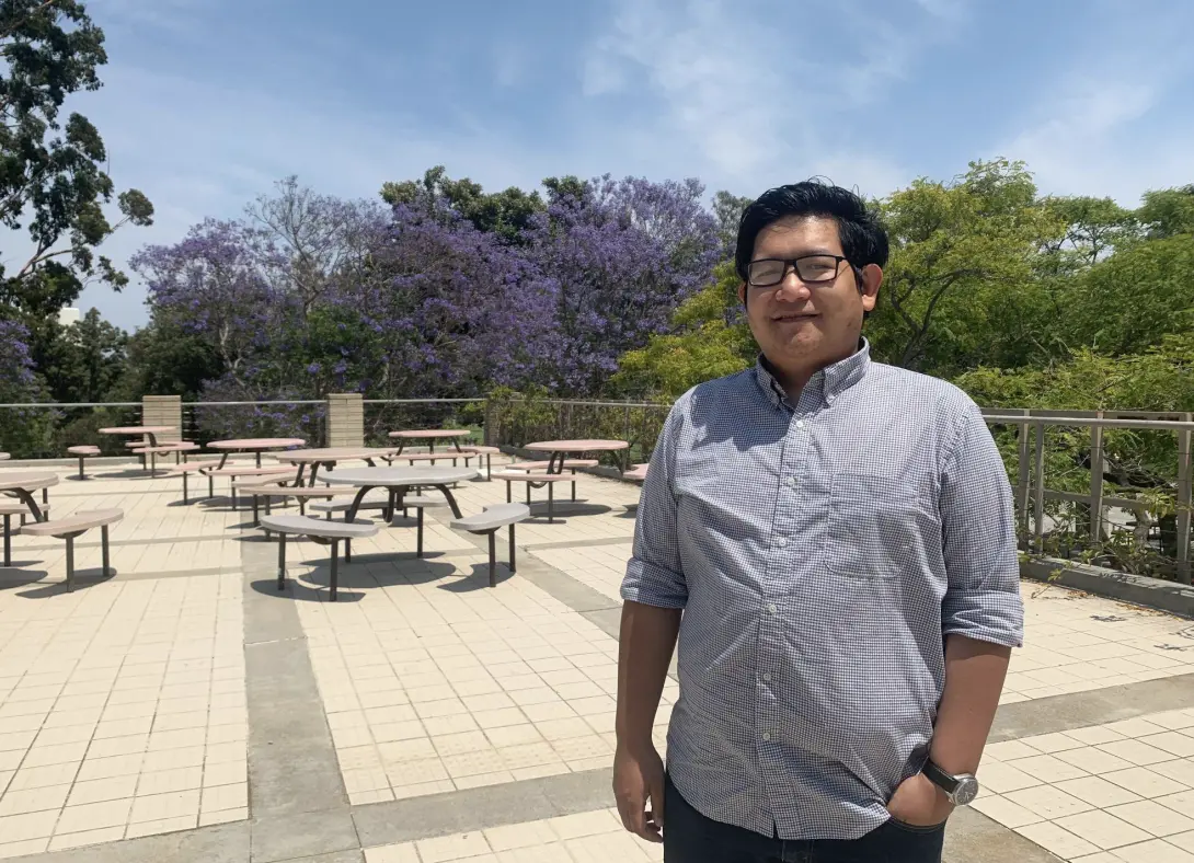 man stands in front of picnic area