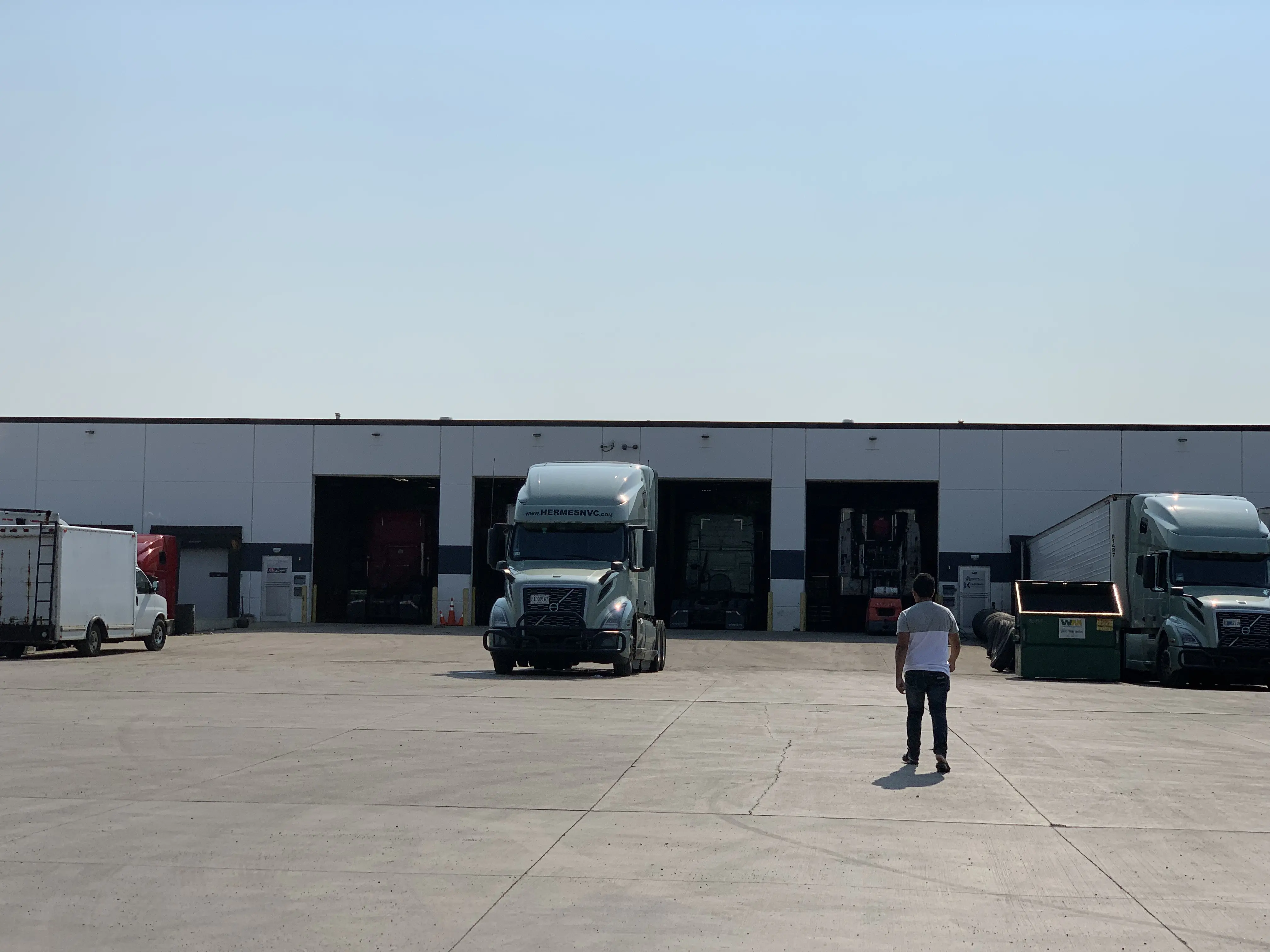 Man walking towards trucking