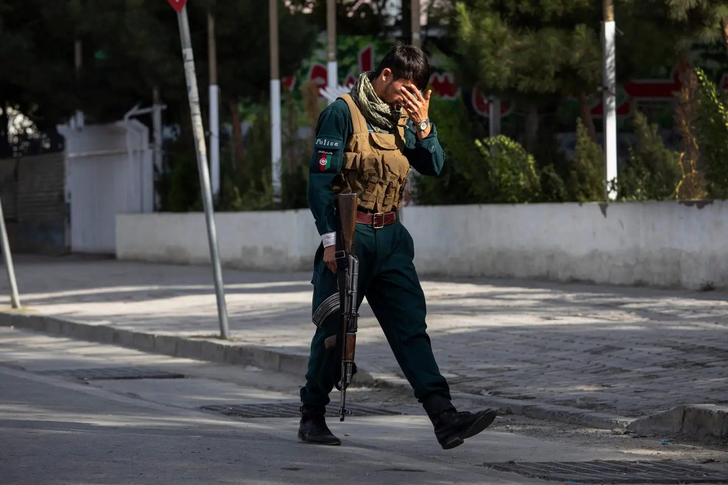 A solider walks with head down