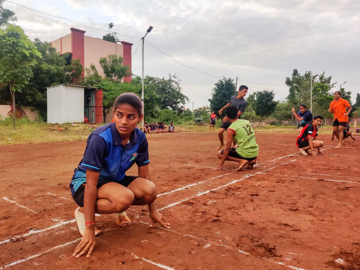 Girls stand on chalk line ready to play sports