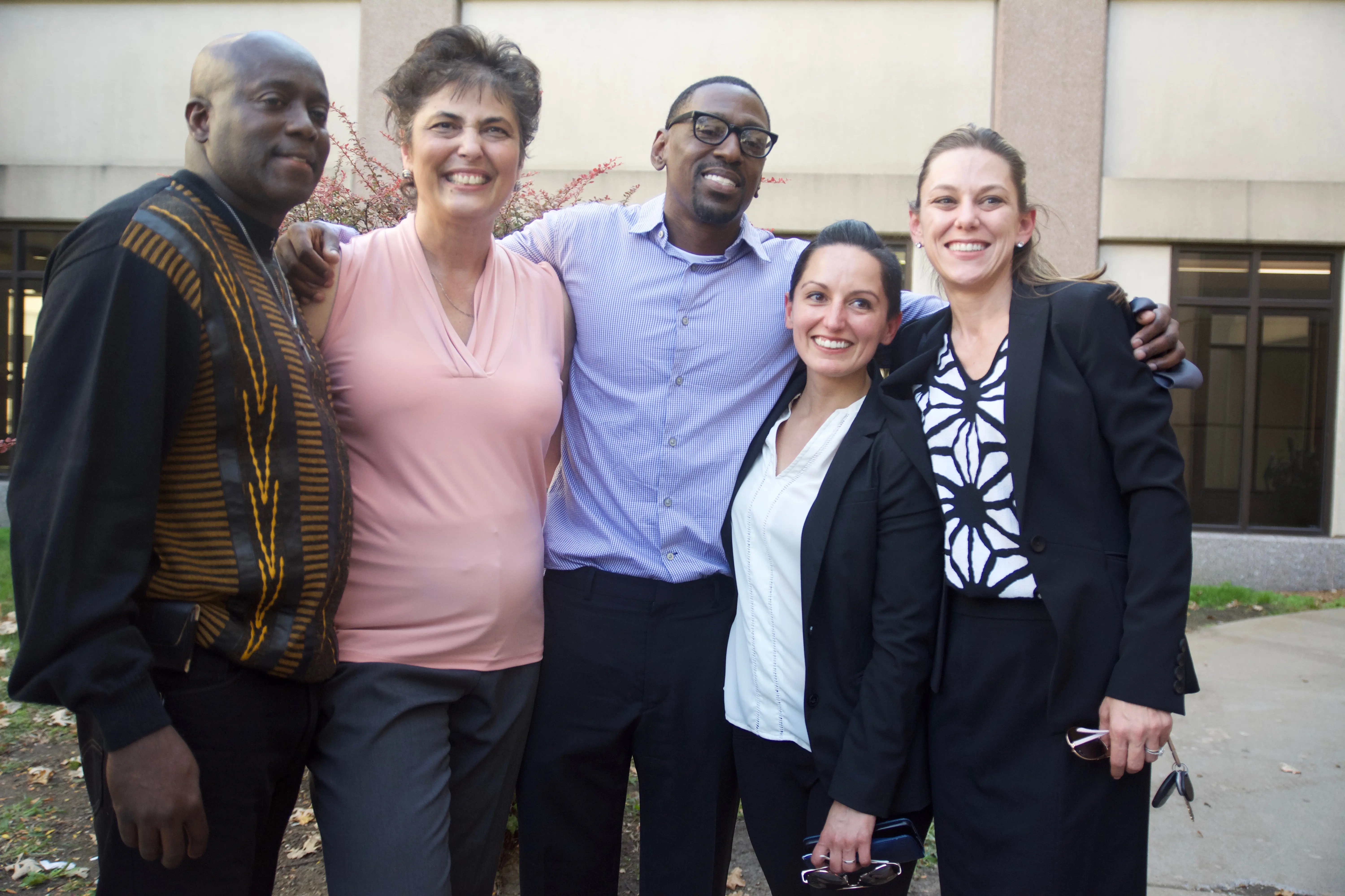 Tricia Rojo Bushnell with Lamonte McIntyre and others on the day of his exoneration.