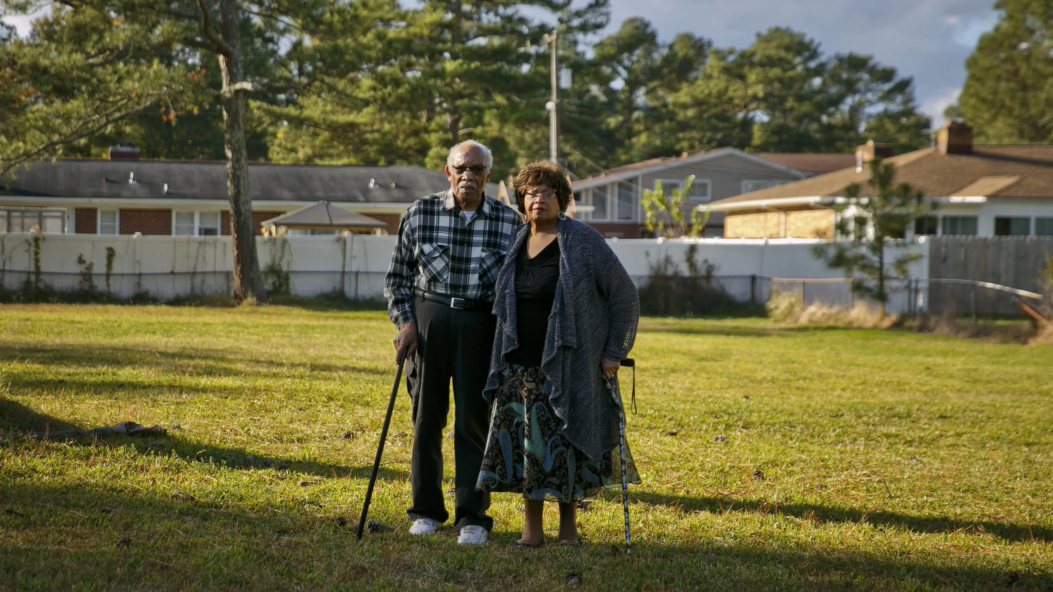 Couple stands in front yard where home used to be