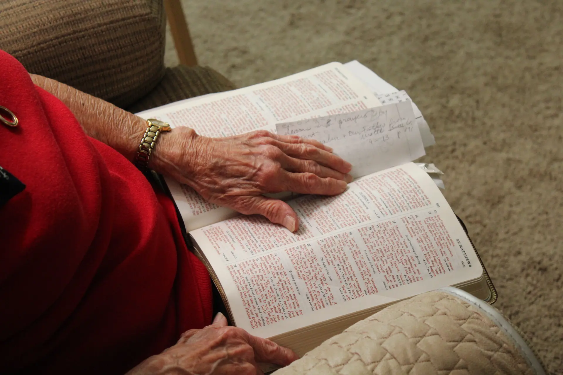 a woman opens a bible