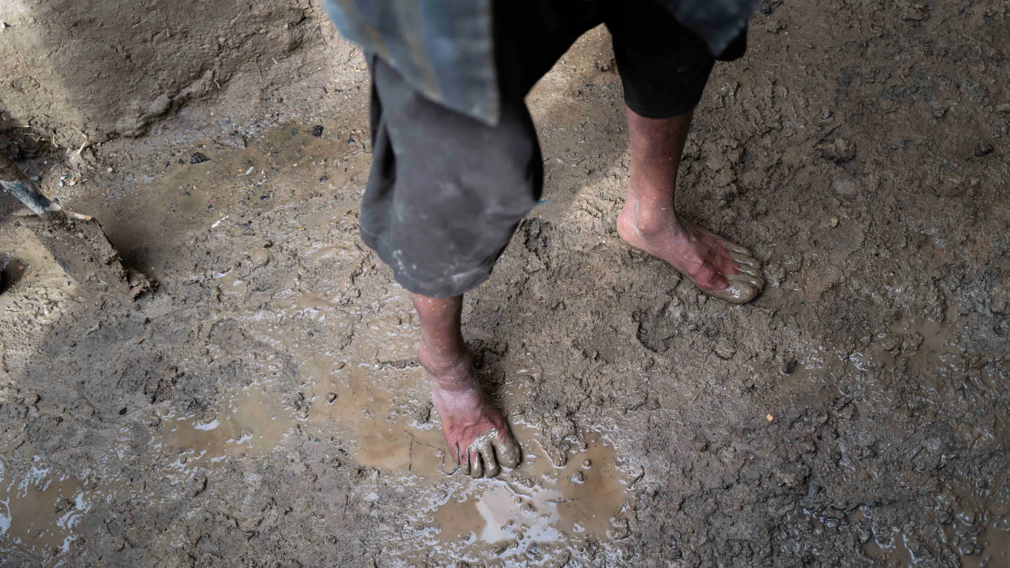 A man in muddy feet