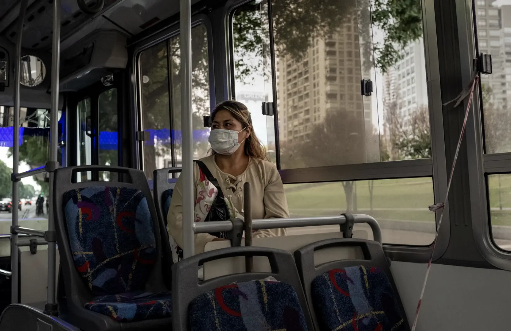 a woman sits on bus