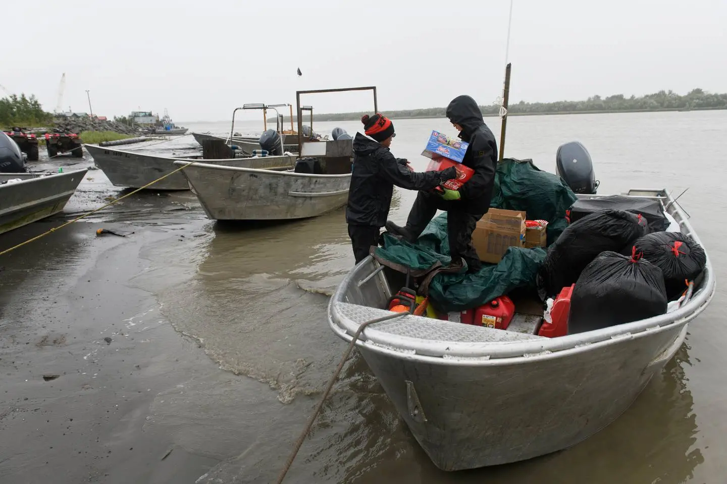 A boat being loaded with other goods to help the Emmonak region