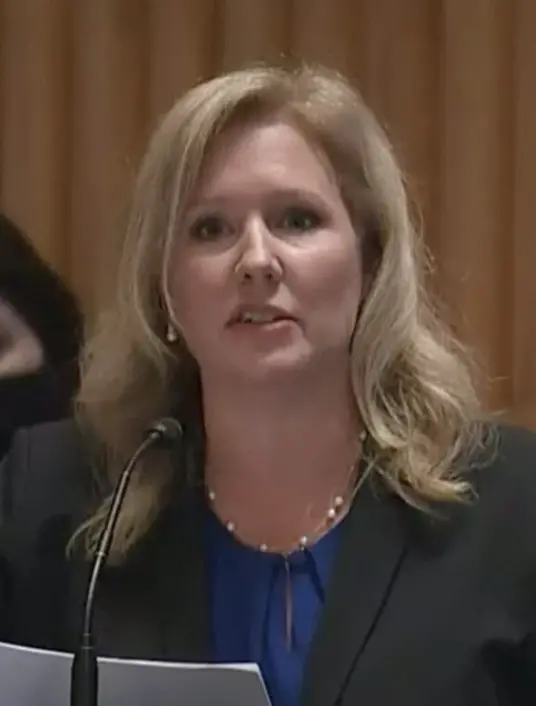 Photo of woman talking into mic