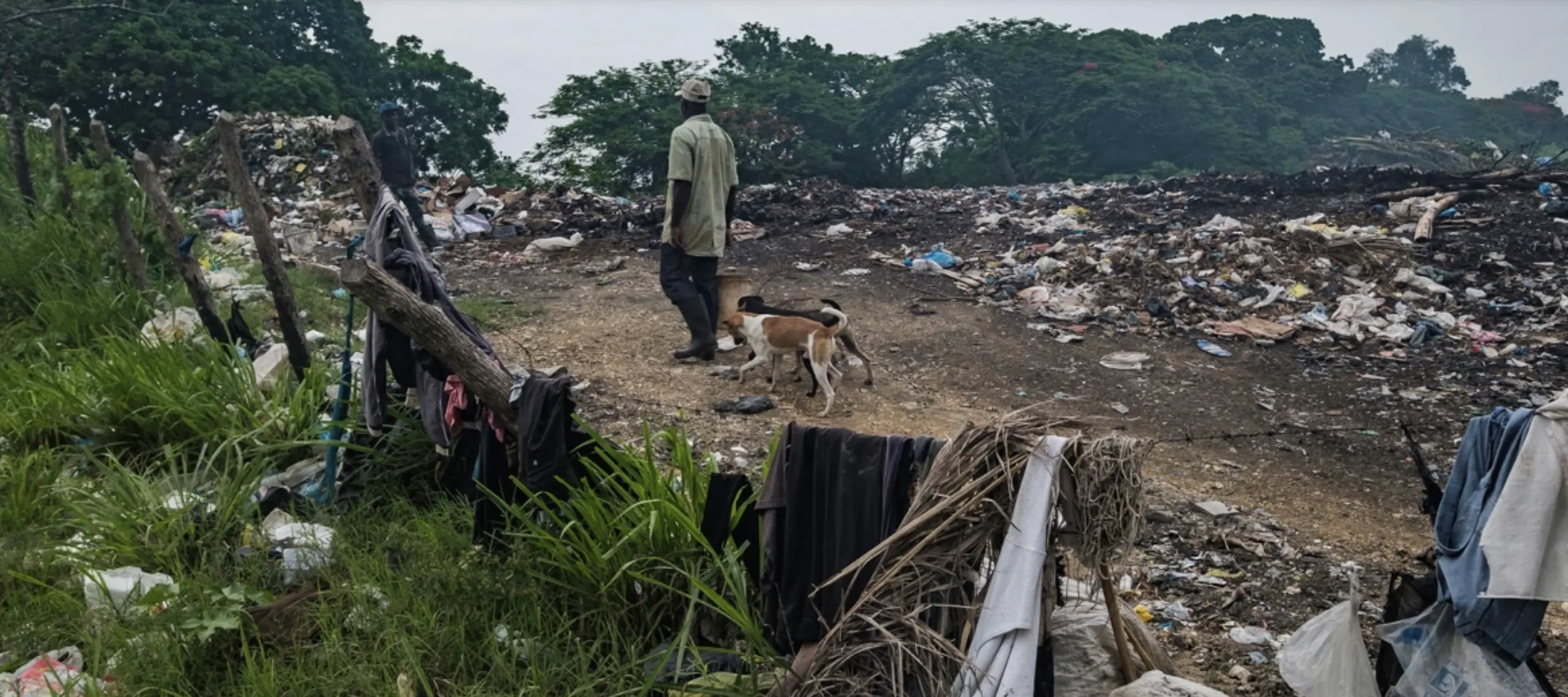 Man walks through a area of batey