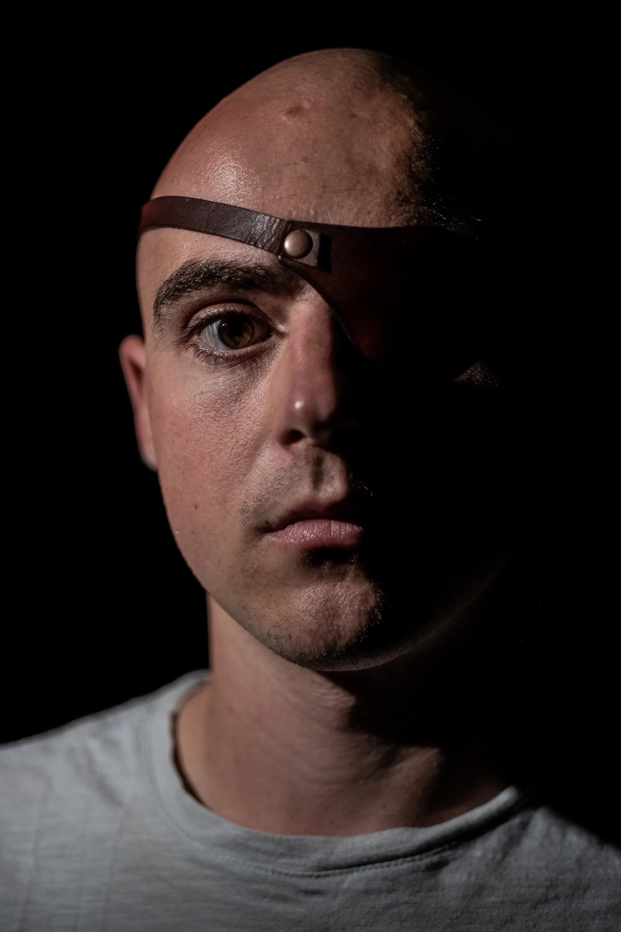 Portrait of Soren Stevenson wearing an eyepatch.