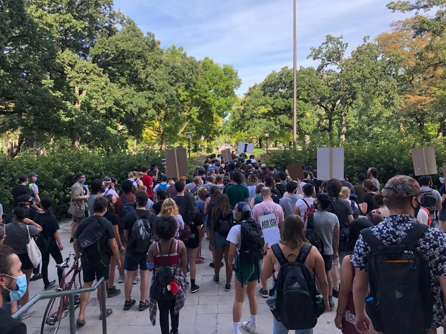 University of Chicago students and community members march across the quad