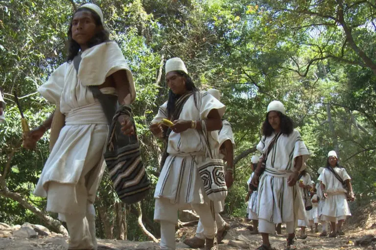 Indigenous shown in their traditional clothing 