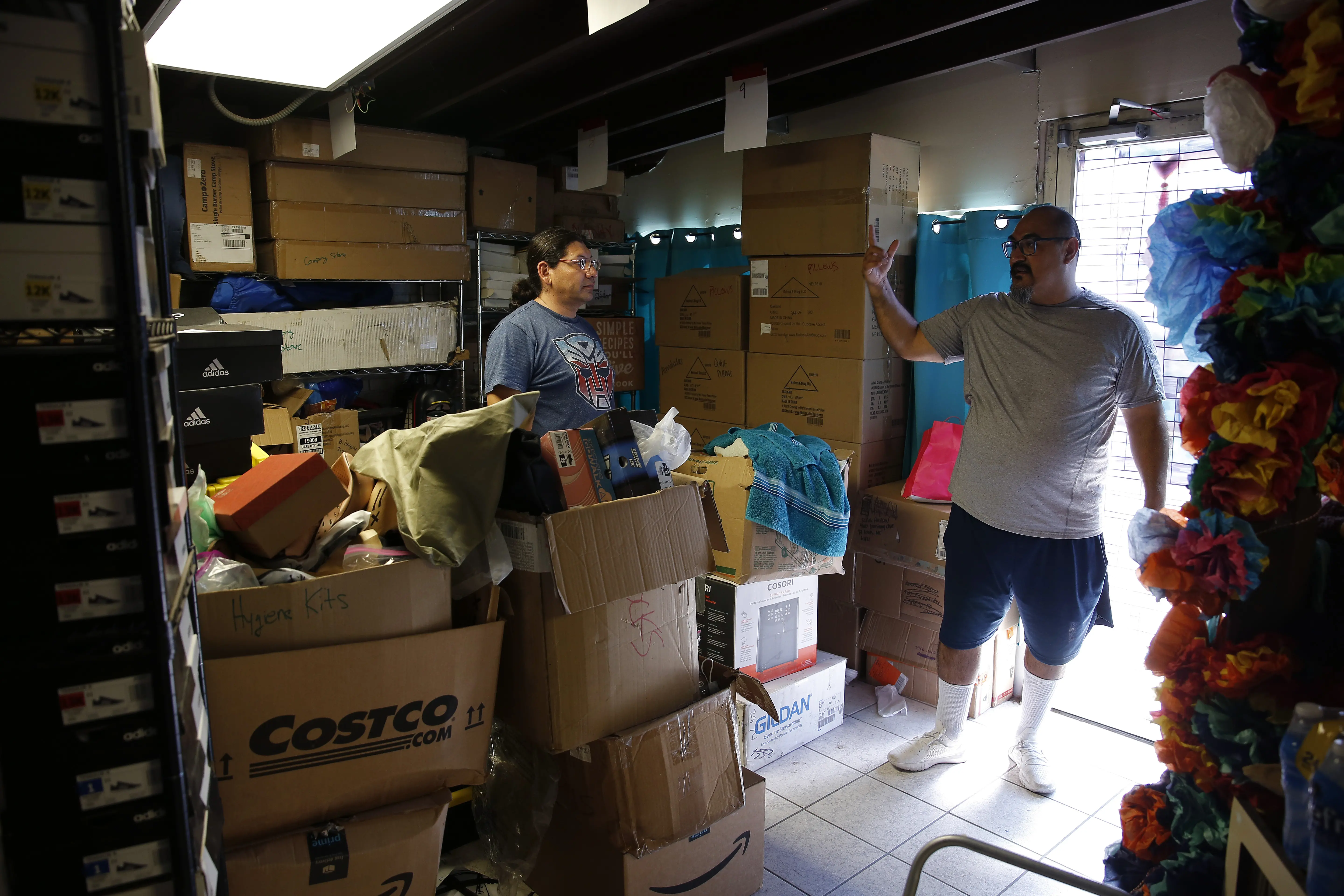 Susana and Juan Ortiz in storage room