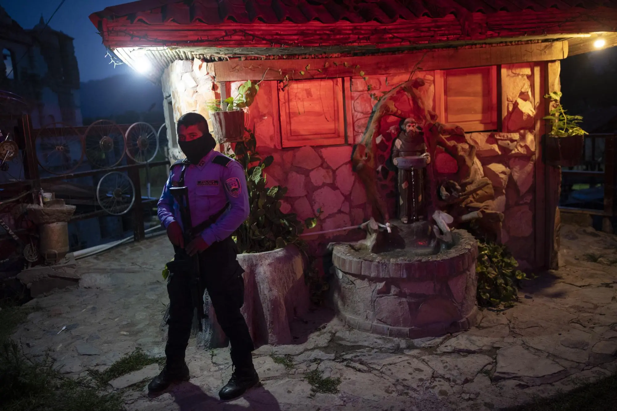 A policeman guard the entrance to a drug rehab center 