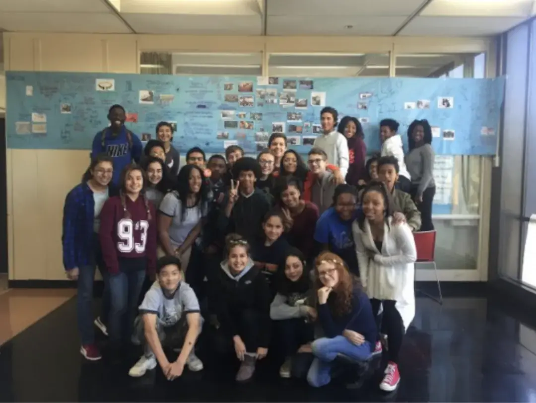 Ninth-graders at Whitney Young Magnet High School in Chicago present a completed timeline that compares events in the Middle East to highly publicized news stories in the U.S. over the course of the nearly two decades explored in Scott Anderson's "Fractured Lands." Students in World Studies classes at Whitney Young spent eight weeks processing Anderson's story through discussion and close-reading. Image by Anne-Michele Boyle. Chicago, 2016.