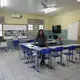 In the midst of summer vacation, Ediana Barbosa stops by her classroom to prepare for the next semester. Image by Anton L. Delgado. Brazil, 2020.