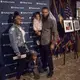 Young activist Kamryn Sloan stands with her brother, Armani Sloan, and his children. Image by Jin Ding. Washington, DC, 2018.