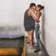 Maria, 35, kisses her daughter during visitation hours at Poli-Valencia, Carabobo. Image by Ana María Arévalo. Venezuela, 2018.