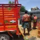 Workers at Shakthi Ganga lift materials into a lorry. The man will be paid 320 rupees, while the women will be paid 160 rupees each. Image by Praveena Somasundaram. India, 2017.