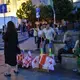 Women sell flags to protesters on Rustaveli Avenue in Tbilisi. Image by Kaitlyn Johnson. Georgia, 2019.