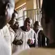 Tolton speaks with Ugandan pastors after a church service. Image by Jake Naughton. Uganda, 2017.