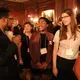 Student fellows Jonathan Custodio, Joy Ikekhua, and Julie De Meulemeester at the evening dinner. Behind them is Pulitzer Center grantee Allison Shelley. Image by Karena Phan. United States, 2018.