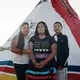 Prairiedawn Thunderchild (right), 16, with her sister Tahnee Thunderchild (center), 14, and their mother. The sisters were almost abducted a year ago by a vehicle of oil workers in Wolf Point. Image by Sara Hylton. United States, 2019.