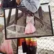 Valenda Morigeau, Jermain Charlo’s aunt, holds a photograph of her niece at an event for missing and murdered Indigenous women and girls at Missoula fair in Montana. Jermain Charlo went missing on 15 June 2018 in Missoula at age 23. Image by Sara Hylton. United States, 2019.