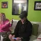 Enedis Flores, left, and her husband, Ramon, look over photos on their phones as they reminisce about past family Thanksgiving holidays spent in the United States in Ramon's Tijuana apartment Sunday, Dec. 1, 2019. Image by Amanda Cowan. Mexico, 2019.