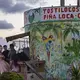 A young woman gathers with friends at Playas de Tijuana for a quinceanera celebration Nov. 29. Quinceanera is the celebration of a girl's 15th birthday, marking the passage from girlhood to womanhood. Image by Amanda Cowan. Mexico, 2019.