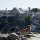 A pair of dogs fight in the Libertad Parte Alta neighborhood near the Tijuana airport Dec. 1. Image by Amanda Cowan. Mexico, 2019.