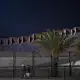 Pedestrians stroll near the border wall on foot from the United States side Nov. 27. Image by Amanda Cowan. United States, 2019.