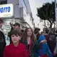 Members of the family express opposite points of view as they try to choose the best route through an intersection in heavy traffic while visiting downtown Tijuana on Saturday, Nov. 30, 2019. Family members are Raymond, 15, Edward, 12, Kennedy, 16, Rayma, 10, and Enedis. Image by Amanda Cowan. Mexico, 2019.