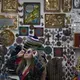 Kennedy Flores tries on a pair of sunglasses while shopping in downtown Tijuana with her family Nov. 30. Image by Amanda Cowan. Mexico, 2019.