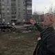 Anna Kireeva near some of the Soviet-era apartment blocks Murmansk, Russia. Image by Amy Martin. Russia, 2018.