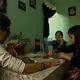 Siblings Jared, 14, Ayleen, 11, and Paulina eat lunch together. The Zarazua children have scholarships from the Mexican government to attend school and special classes. Image by Erika Schultz. Mexico, 2019.