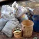 Bags of gold ore are confiscated from zama zamas at the abandoned Blyvooruitzicht Gold Mine. Image by Mark Olalde. South Africa, 2017.