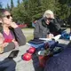 Roberta Benefiel-Frampton, left, discusses a plan for protesting the NorthEast Governors and Premiers meeting with Meg Sheehan, director of the North American Megadams Resistance Alliance, at New River Beach Provincial Park in Lepreau, New Brunswick, Canada, on Sept. 8, 2019. Image by Michael G. Seamans. Canada, 2019.