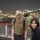 Duane Hanson, center, laughs with his partner Sally Kwan as they walk along the East River near Sally’s childhood neighborhood in Chinatown, Manhattan, on May 19, 2019. Image by Michael G. Seamans. United States, 2019.