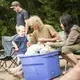 Duane Hanson greets his grandson, Jensen, while snapping green beans with Sally Kwan at Spencer Lake in T3 R5, in the Unorganized Territories of Maine, on Aug. 3, 2019. Image by Michael G. Seamans. United States, 2019.