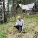 Duane Hanson checks the soil of his garden as prepares for the new growing season at his homestead in the Unorganized Territories in the north woods of Maine near T5 R7 on May 27, 2019. Image by Michael G. Seamans. United States, 2019.