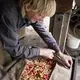 Duane Hanson presses his homegrown apples into cider at his homestead in T5 R7 in the Unorganized Territories on Sept. 17, 2019. Image by Michael G. Seamans. United States, 2019.