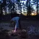 Duane Hanson harvests some garlic for dinner at his homestead in the Unorganized Territories in the north woods of Maine near T5 R7 on May 27, 2019. Image by Michael G. Seamans. United States, 2019.