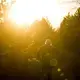 Duane Hanson walks in to the sunset near his homestead in the Unorganized Territories in the north woods of Maine near T5 R7 on May 6, 2019. Central Maine Power officials claim this area to be scarred by logging. Hanson points out that he is walking on an old logging road that has grown in. Image by Michael G. Seamans. United States, 2019.