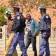 Alleged zama zamas are arrested by police in Johannesburg. Image by Mark Olalde. South Africa, 2017.<br />
