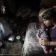 Fljurija Katunari, 18, cares for her two-month-old daughter in a shack without water or electricity on the outskirts of Belgrade, Serbia. Neither she nor her husband have any formal employment. Tens of thousands of Roma people were displaced by the war in Kosovo, including Fljurija’s family, and settled in Serbia. Seventeen years later, many still lack the documents, including a simple ID card, that would entitle them to social benefits, health care, and the right to work. Image by Jodi Hilton. Serbia.