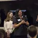 Pulitzer Center Executive Editor laughs with Managing Director Nathalie Applewhite during staff introductions. Behind them are Pulitzer Center staff members Steve Sapienza and Katherine Doyle. Image by Jin Ding. United States, 2018.