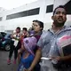 Migrants listen to a Mexican immigration official at a checkpoint in Nuevo Laredo. The group was returned to Mexico, and Mexican immigration officials planned to transport them to Monterrey, Nuevo León. Image by Miguel Gutierrez Jr. United States, 2019.